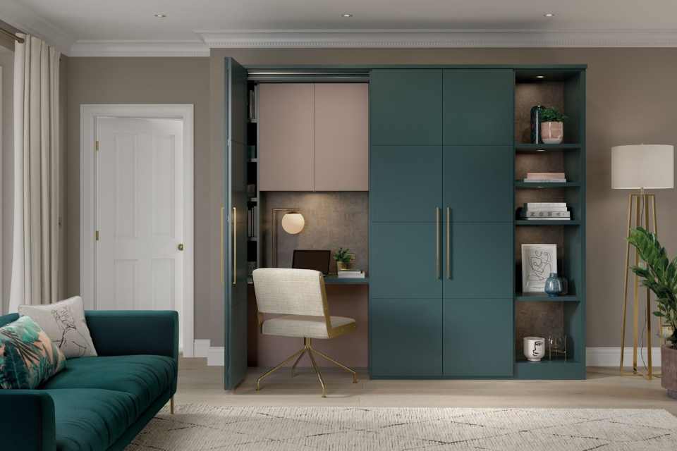 modern hidden office in statement blue cabinet of living room